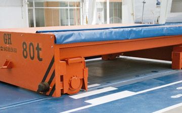 Cable reel powered transfer carts on rails for cranes